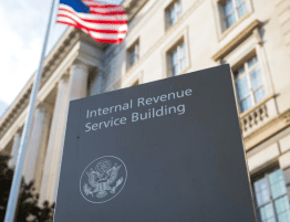 IRS building and sign with US flag