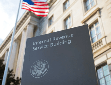 IRS building and sign with US flag