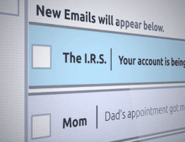 Image of a computer screen with an email from "The I.R.S." with the subject line: Your account is being audited.