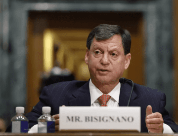 IRS CEO Frank Bisignano sitting at court.