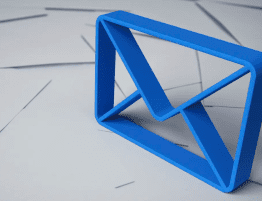 A three dimensional blue outline of an envelope standing on top of a mess of white envelopes