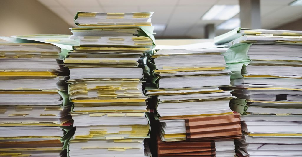 piles of messy, over-packed files in a row
