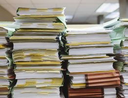 piles of messy, over-packed files in a row
