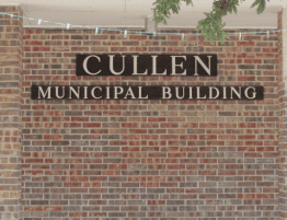 a brick wall with lettering on it that says "Cullen Municipal Building"