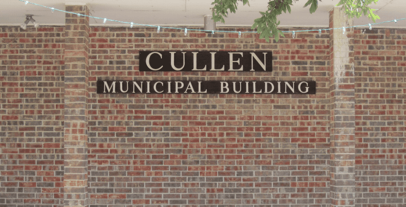 a brick wall with lettering on it that says "Cullen Municipal Building"